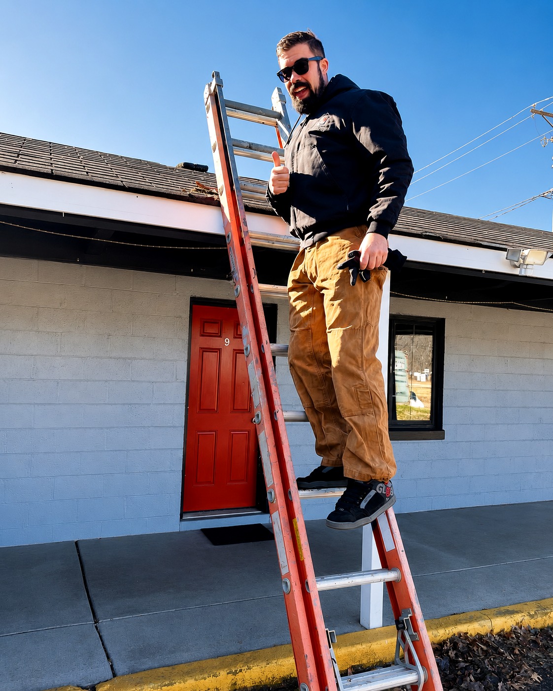 Teddy Miller working on a ladder